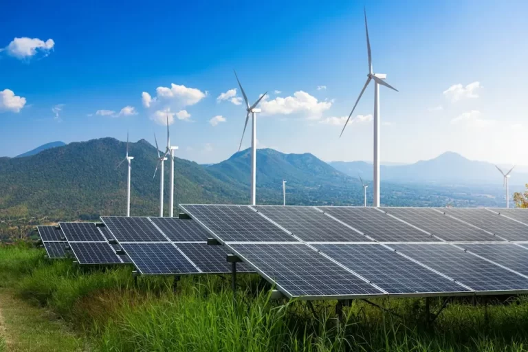 solar and wind turbine on a field - renewable energy